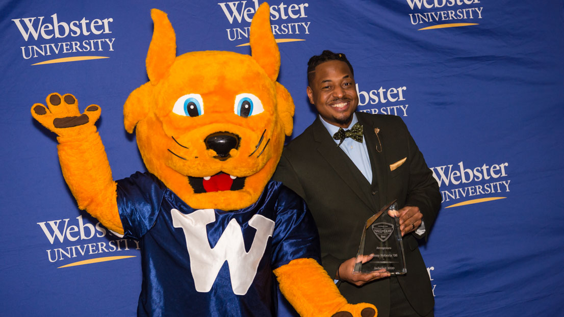 The Gorlok celebrates with an award recipient.