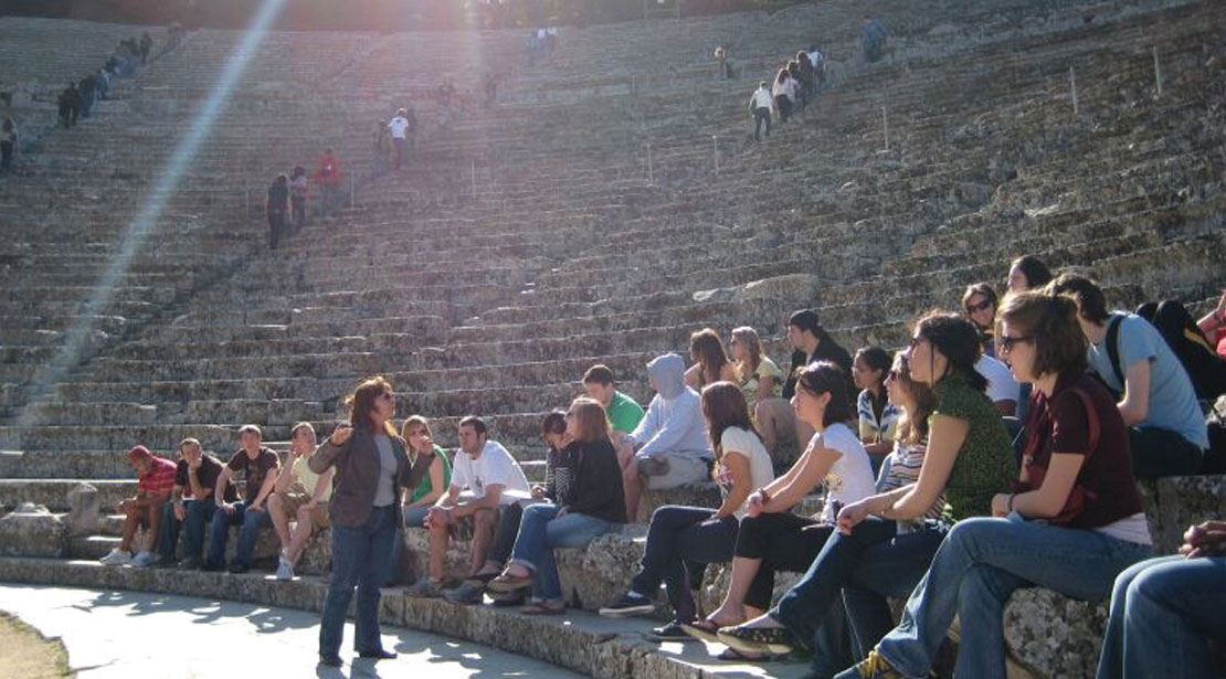 A group of students from our Athens campus visits a Greek historical site for a lecture.