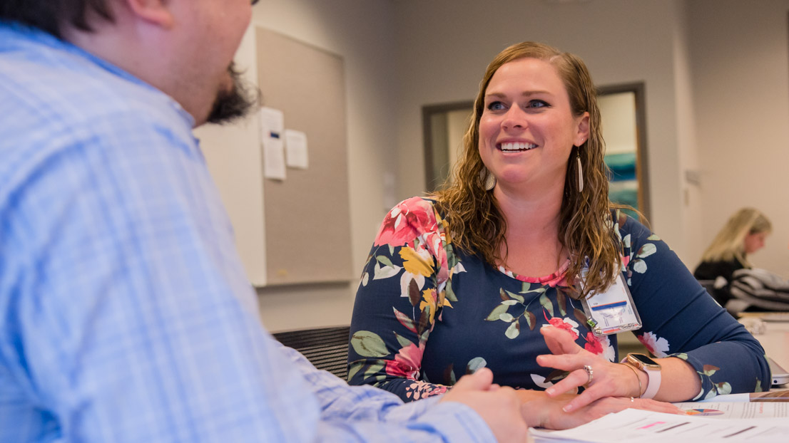 A corporate employee student engaged in class discussion