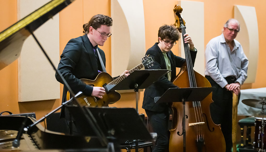 A group of students playing various instruments during a Webster University Jazz Combo concert.