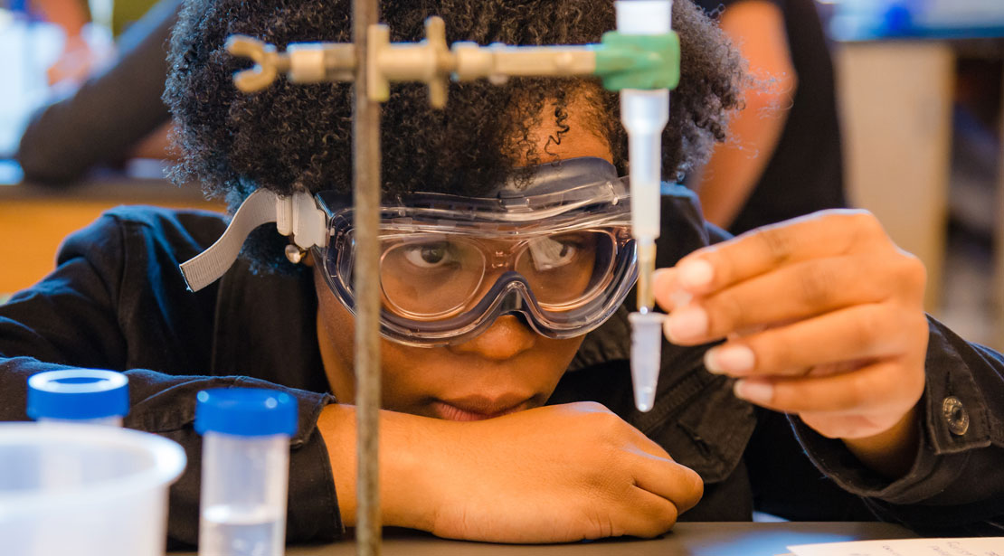 Webster student conducting an experiment.