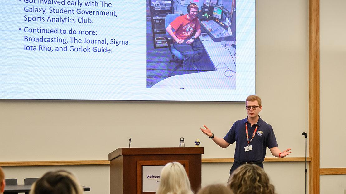 Michael Langston gives his keynote address with a slide of his experiences at Webster University