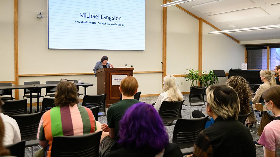Nancy Hellerud introduces keynote speaker Michael Langston