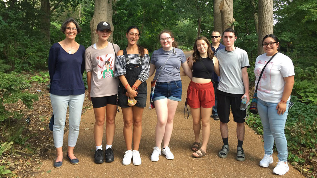 Dr. Thompson and seven honor students pose on nature trail