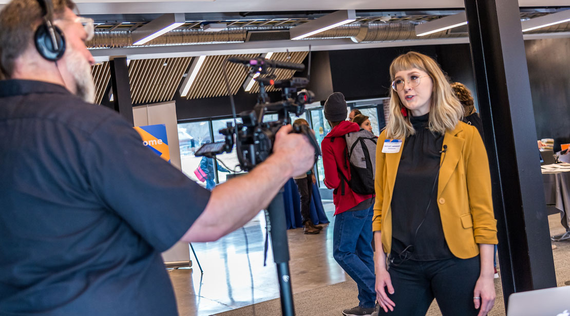 student journalist being filmed in Media Commons during Media Academy