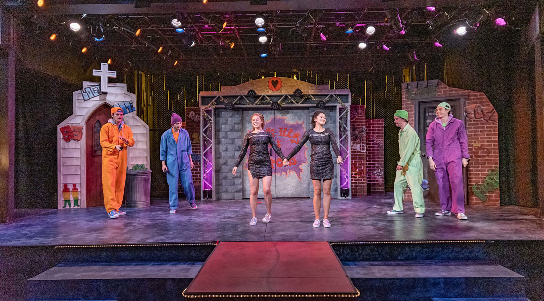 The whole stage with six actors across its length
