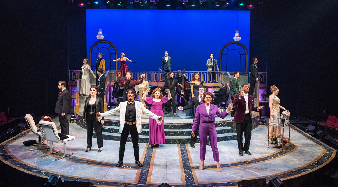 The whole cast and band of the Sondheim on Sondheim production performs across the stage