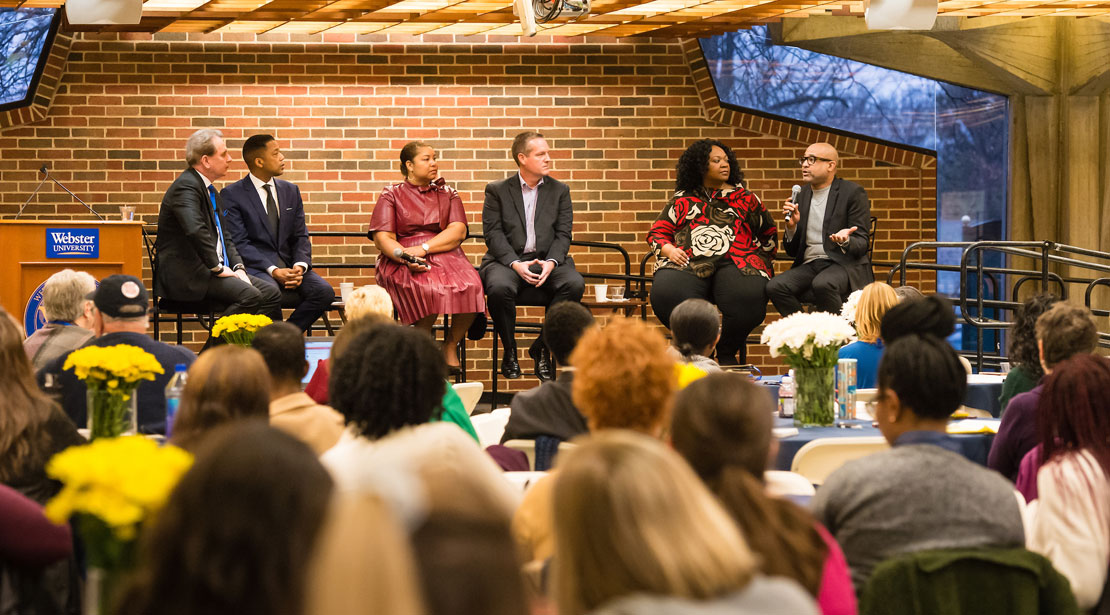 President Schuster and Chief Diversity Office Vincent Flewellen sit on stage with four journalists from The St. Louis Business Journal