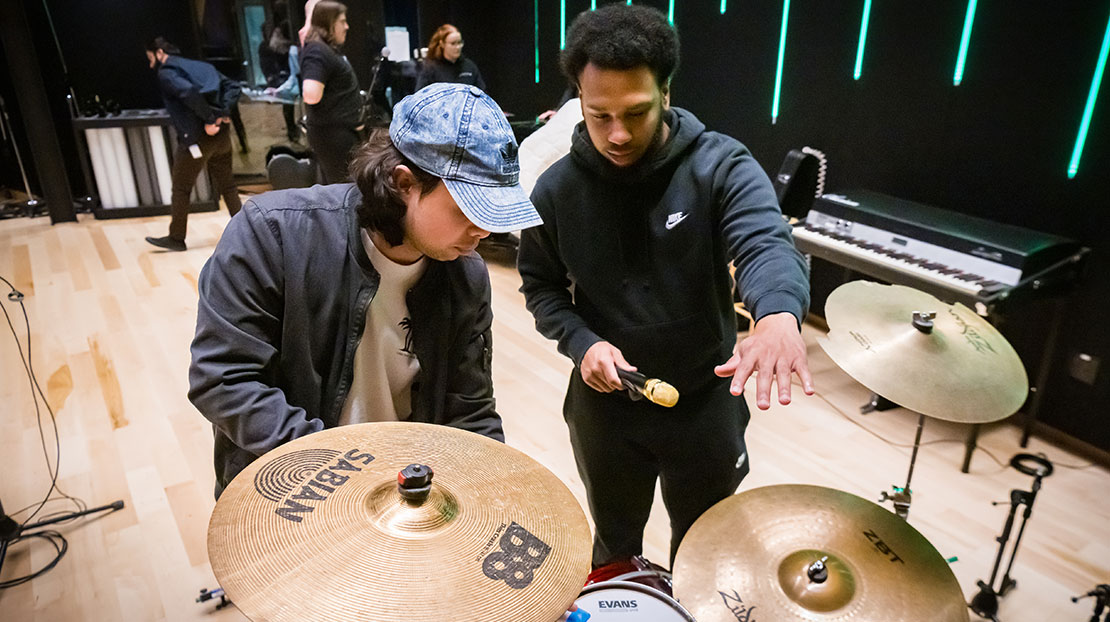 students discuss microphone options for cymbals