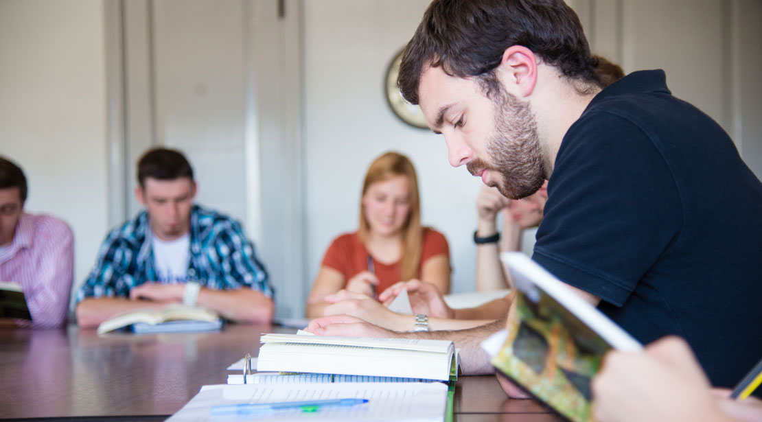 Students reading in a classroom