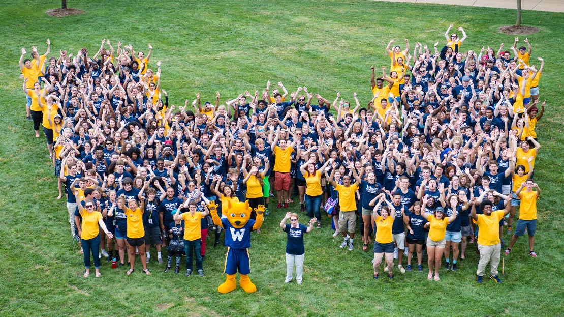 Students and staff form the giant W, 2023