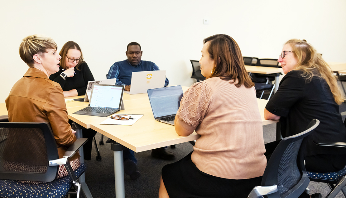 A class and the professor in a teaching cohort in School of Education