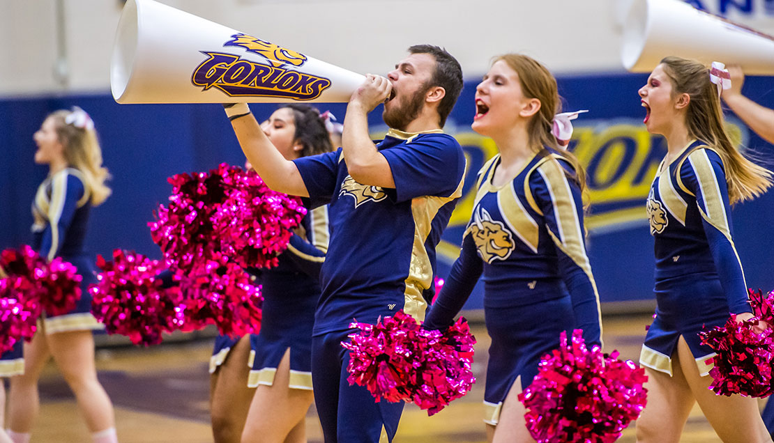 Cheerleaders yelling the Gorloks on 