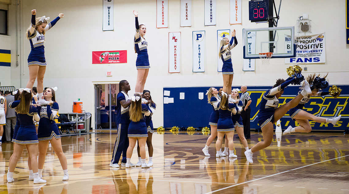 Cheerleaders building pyramids during halftime 