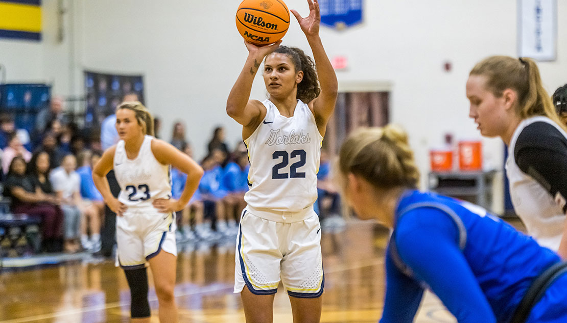 Female student shooting a freethrow 