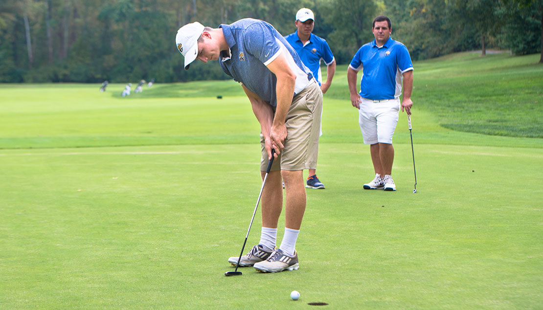 Men's golf students on the course 