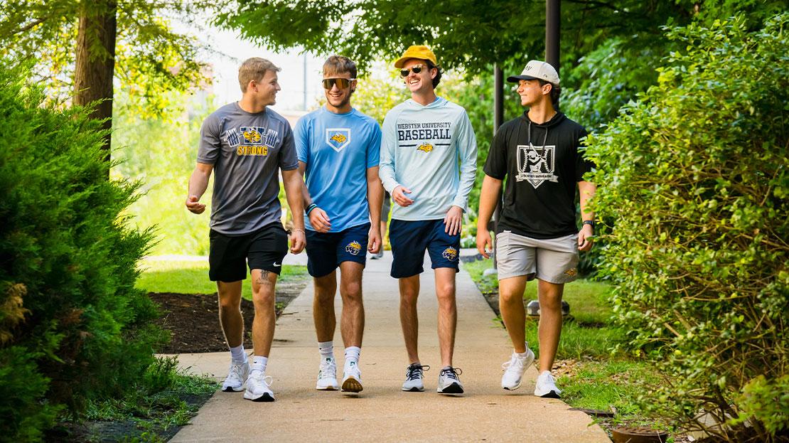 A group of Webster students walking together on campus.