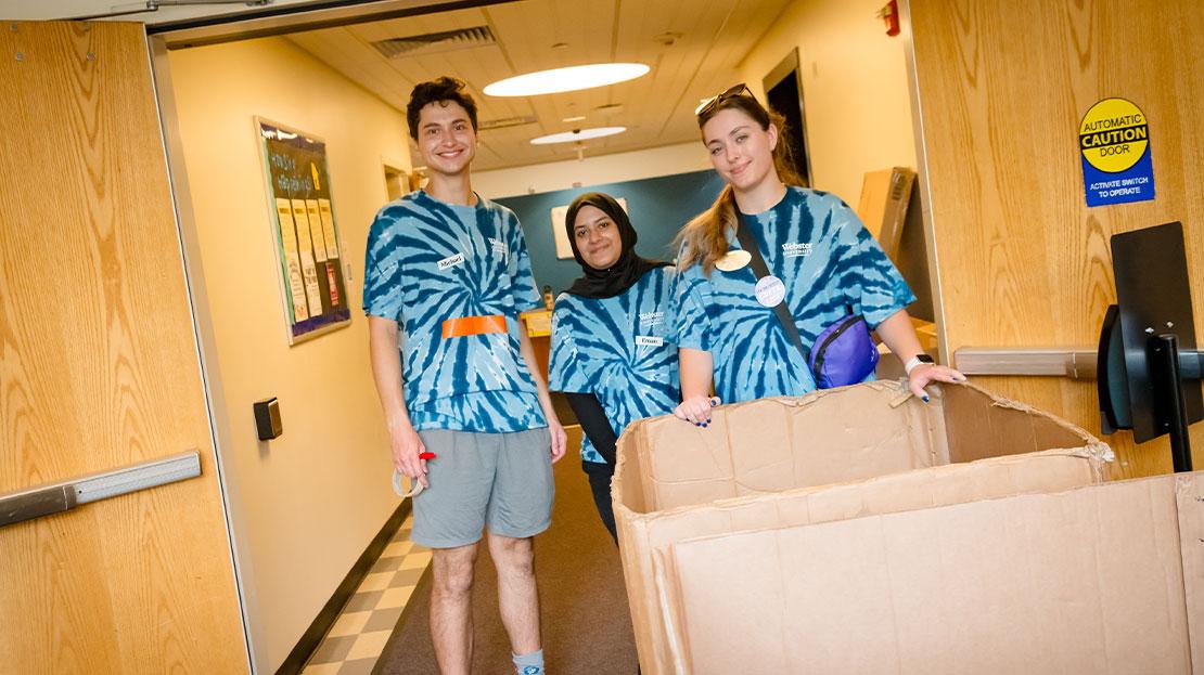 A group of Webster students help new students move their belongings into their dorm rooms at Webster University.