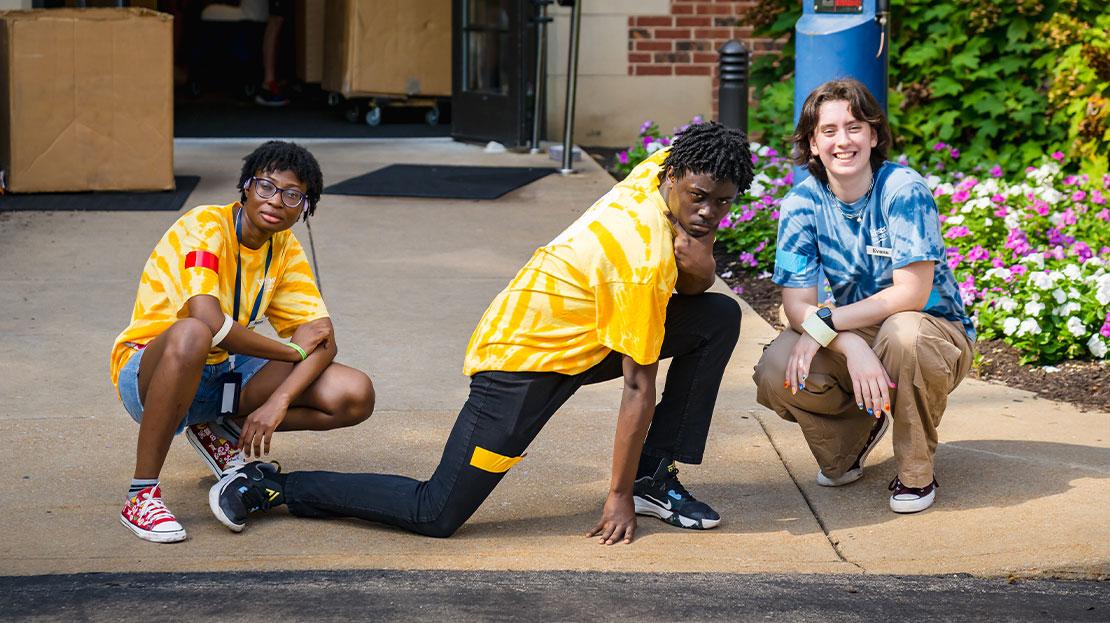 A group of Webster students posing together on move-in day.