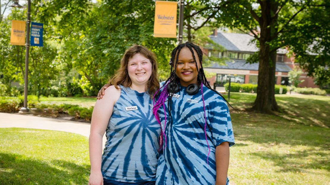 Webster students posing together on move-in day.