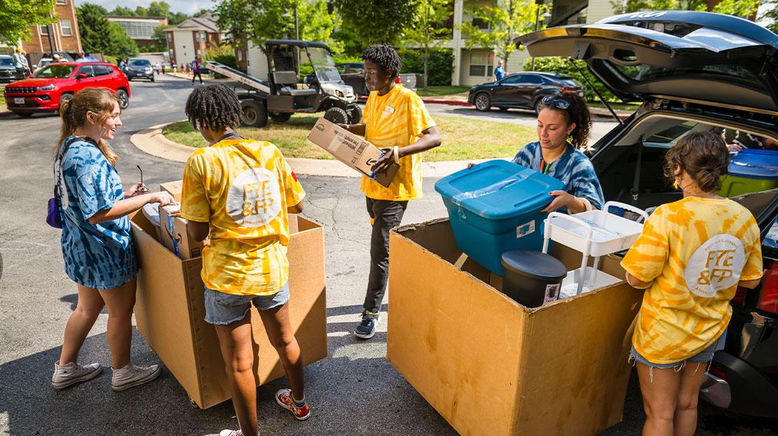 A group of Webster students help new students move their belongings into their dorm rooms at Webster University.