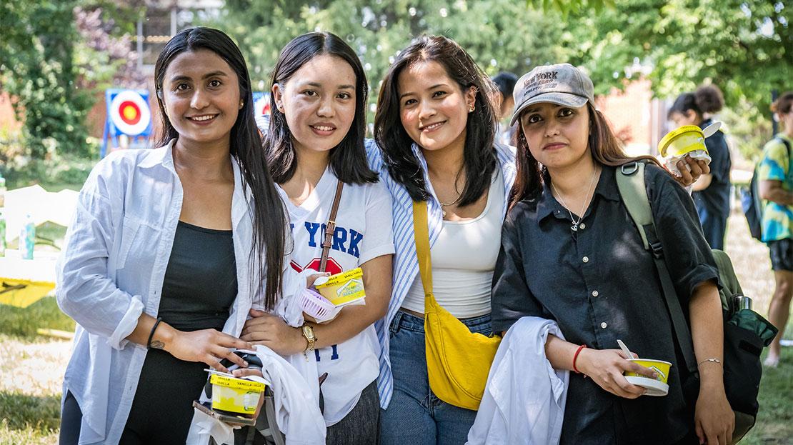 A group of students pose for a photo at a campus event.