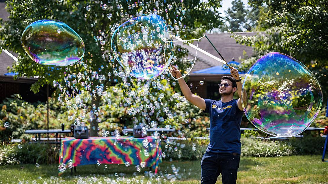 A student with a bubble wand.