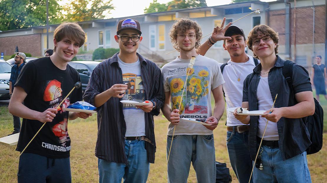 A group of students attending the bonfire night.