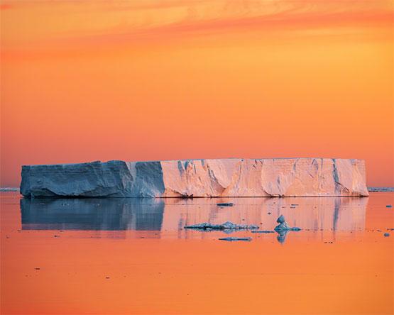 Tabular iceberg at dawn on the solstice in the Weddell Sea, Antarctica, on Dec. 22, 2021.