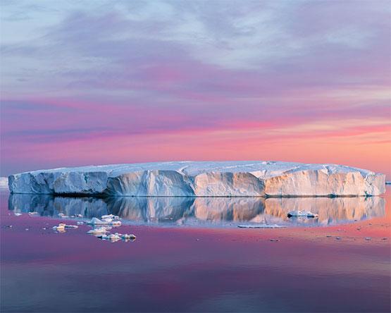 Tabular iceberg at sunrise on the solstice, Weddell Sea, Antarctica on Dec. 22, 2021.