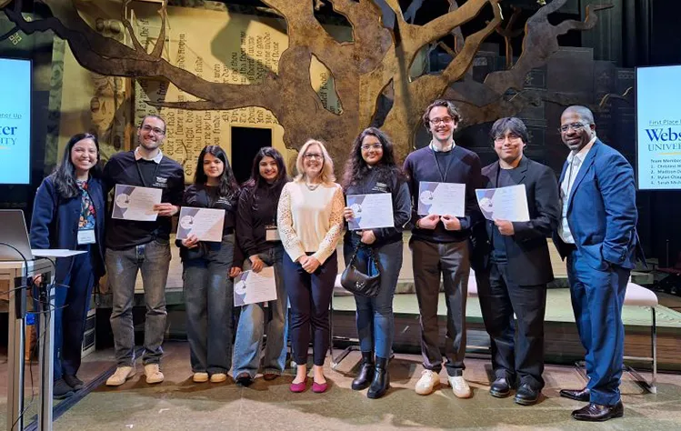 Group of Webster University marketing students and faculty pose with award certificates at an AMA conference.