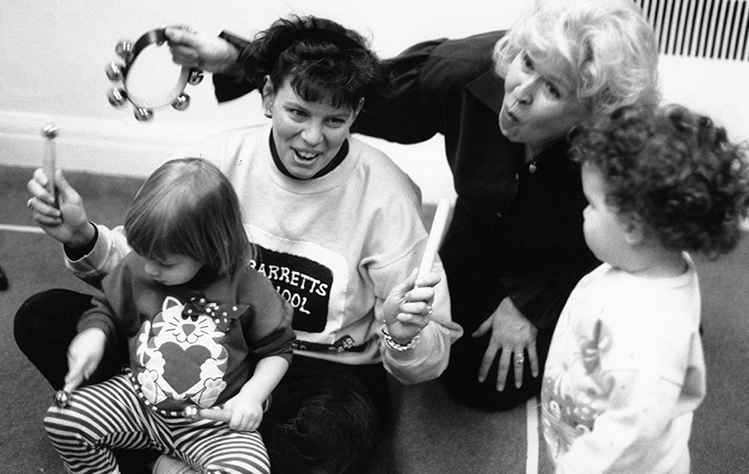 Children in a Kindermusik class with teacher, Donna Evans