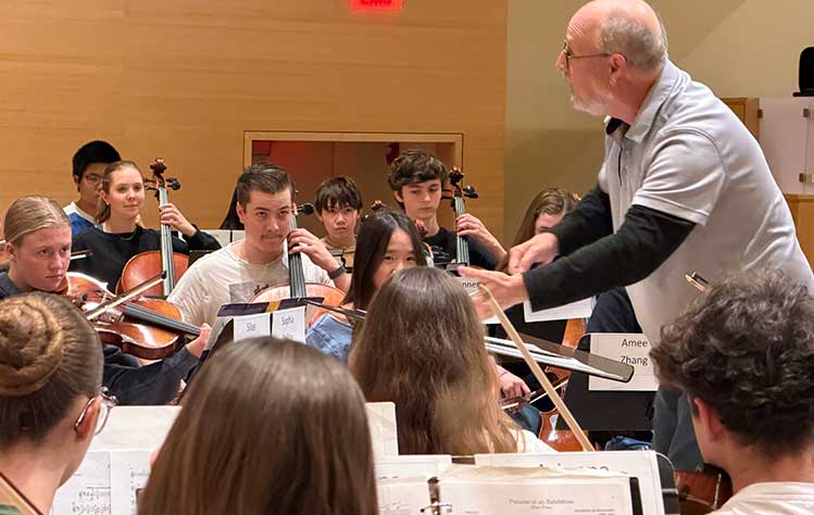 Leon Steward conducts at YPCO rehearsal