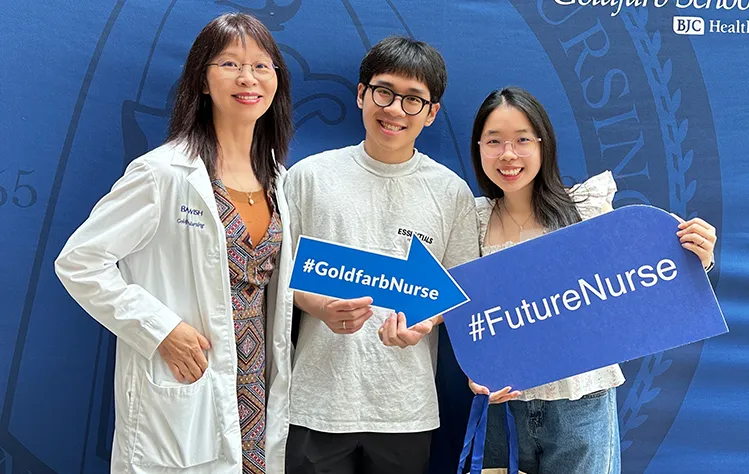 Eleanor Dang, right, with Goldfarb professor Dr. Yu and husband Braydon