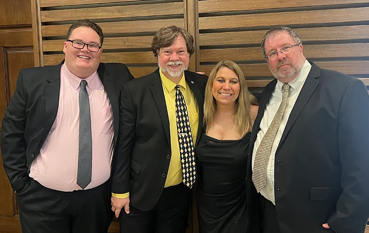 John Wallis with Webster professors Tom Serfass and Gina and Scott Jensen