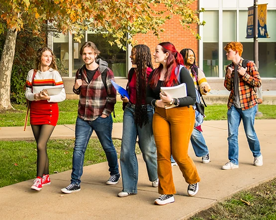 A group of students walking on campus.