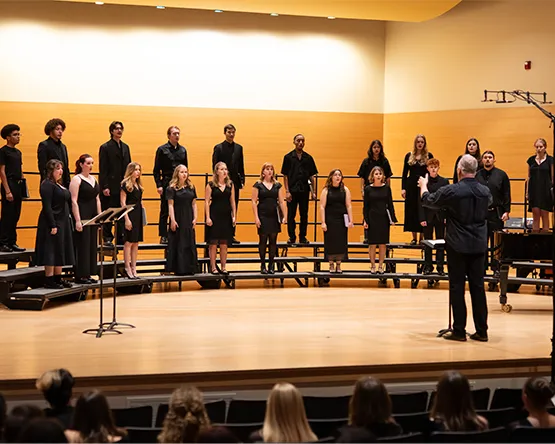 Student vocalists perform in a choral ensemble.