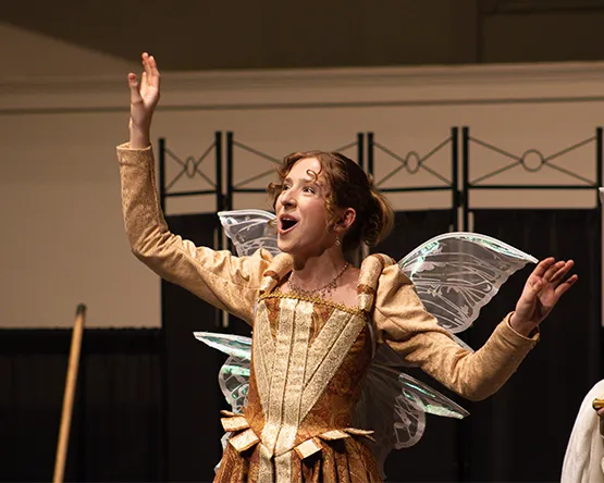 Student vocalist in an opera performance.