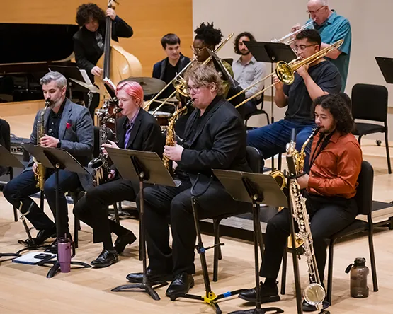 A group of students playing a variety of jazz instruments.