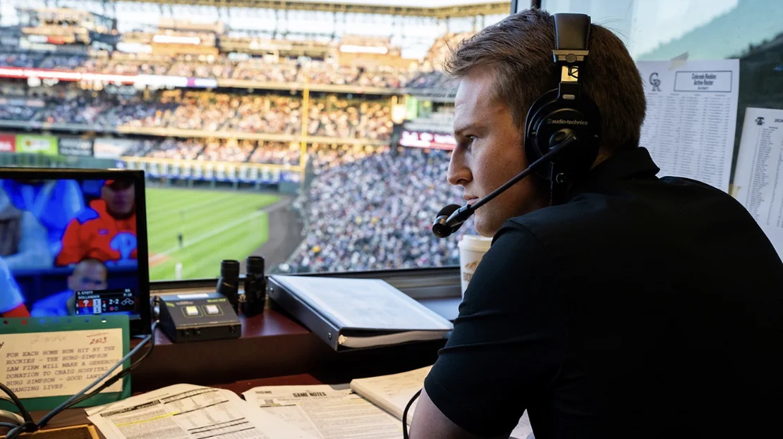 Zach Goodman working during a baseball game.