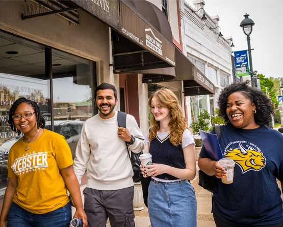 Webster students walking through Webster Groves near campus.
